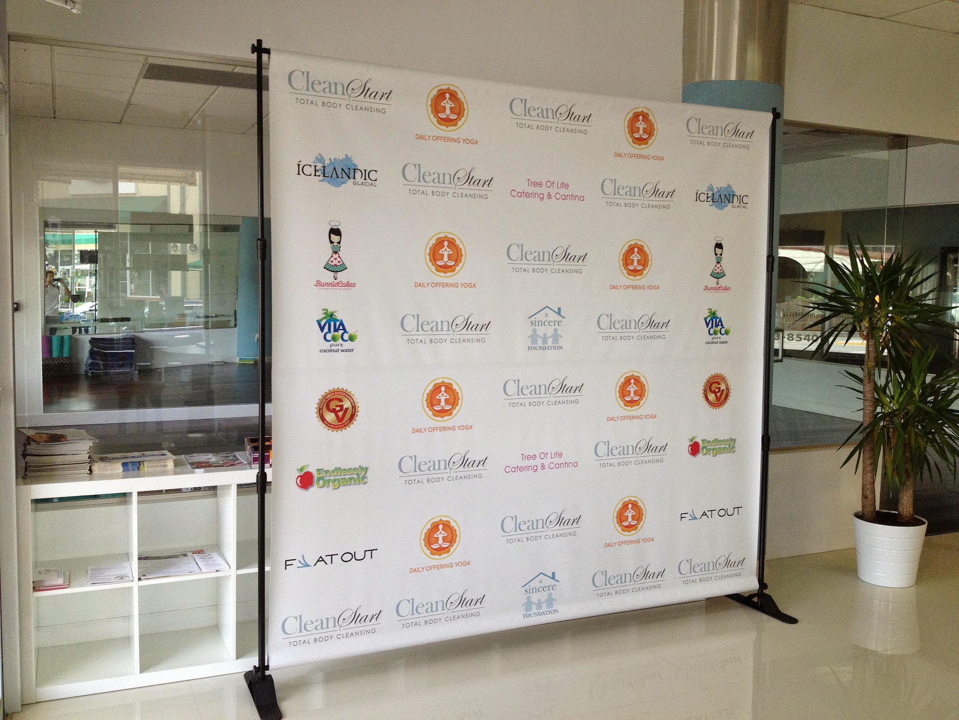White and gold step and repeat backdrop at Miami Beach luxury event